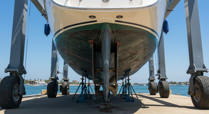 Yacht in dry dock showing stern thruster maintenance and technical service work